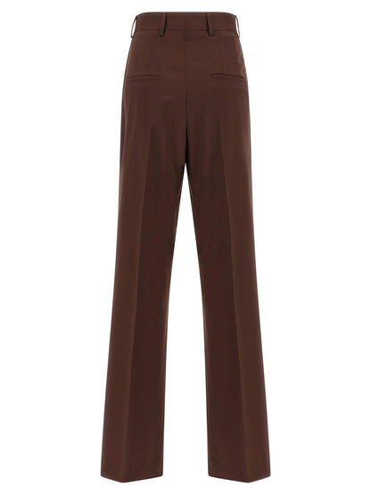 Trousers by Armarium for women in virgin wool brown presents a perennial silhouette, meticulously tailored with a straight-leg cut, long finish, and an elegant .