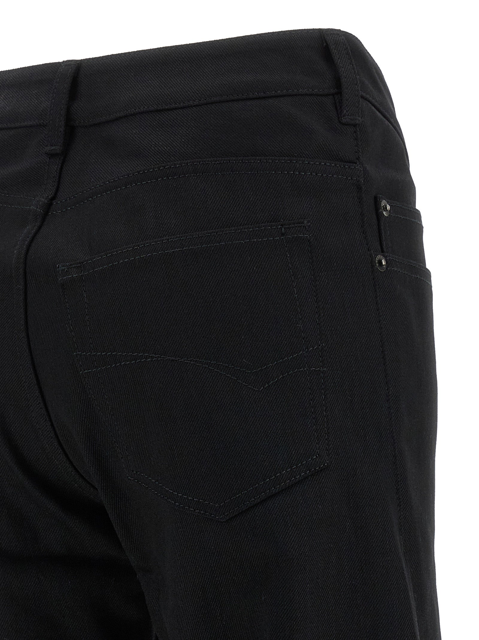 Jeans by Balenciaga for women in denim cotton black & signature presents a tailored silhouette, showcasing a tailored straight, flared & wide and long cut with a refined mid rise for a truly tailored aesthetic.