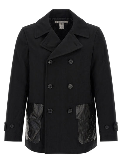 Overcoat by Comme Des Garçons for men in polyester black features a contemporary silhouette showcasing a contemporary and refined pockets & insulated for a sophisticated finish.