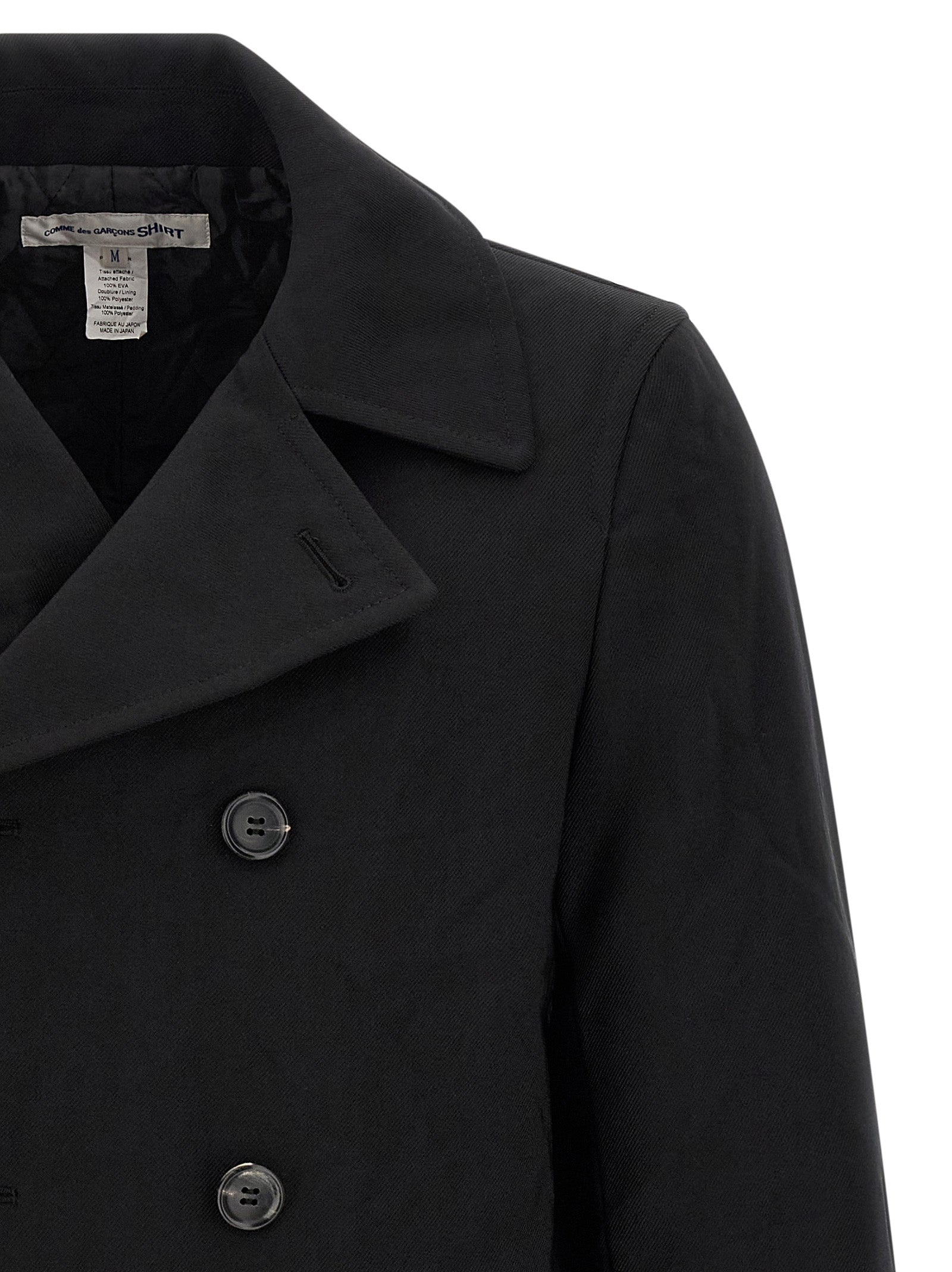 Overcoat by Comme Des Garçons for men in polyester black presents a luxurious silhouette, showcasing a luxurious and sophisticated pockets & insulated for a premium, luxurious look.