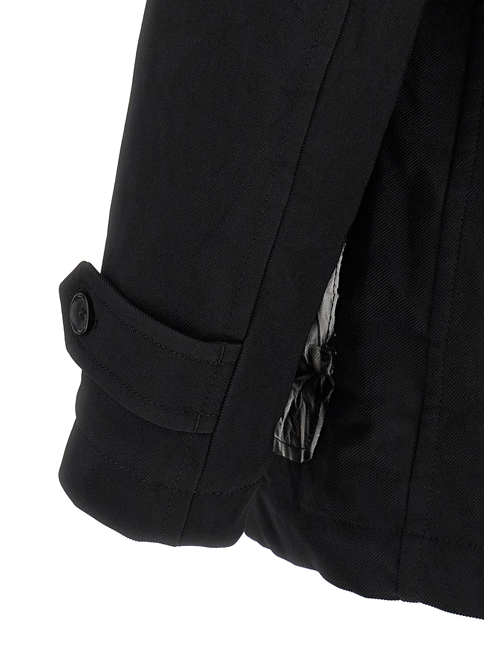 Overcoat by Comme Des Garçons for men in polyester black features an voluminous silhouette, showcasing distinct pockets & insulated and a voluminous for a truly voluminous aesthetic.
