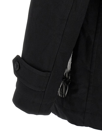 Overcoat by Comme Des Garçons for men in polyester black features an voluminous silhouette, showcasing distinct pockets & insulated and a voluminous for a truly voluminous aesthetic.