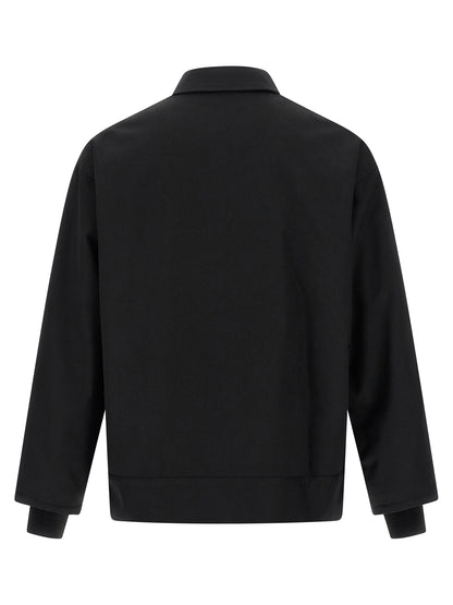 Overcoat by Comme Des Garçons for men in wool & polyester black features an satoral silhouette, showcasing a sophisticated and satoral pockets for a premium, timeless look.