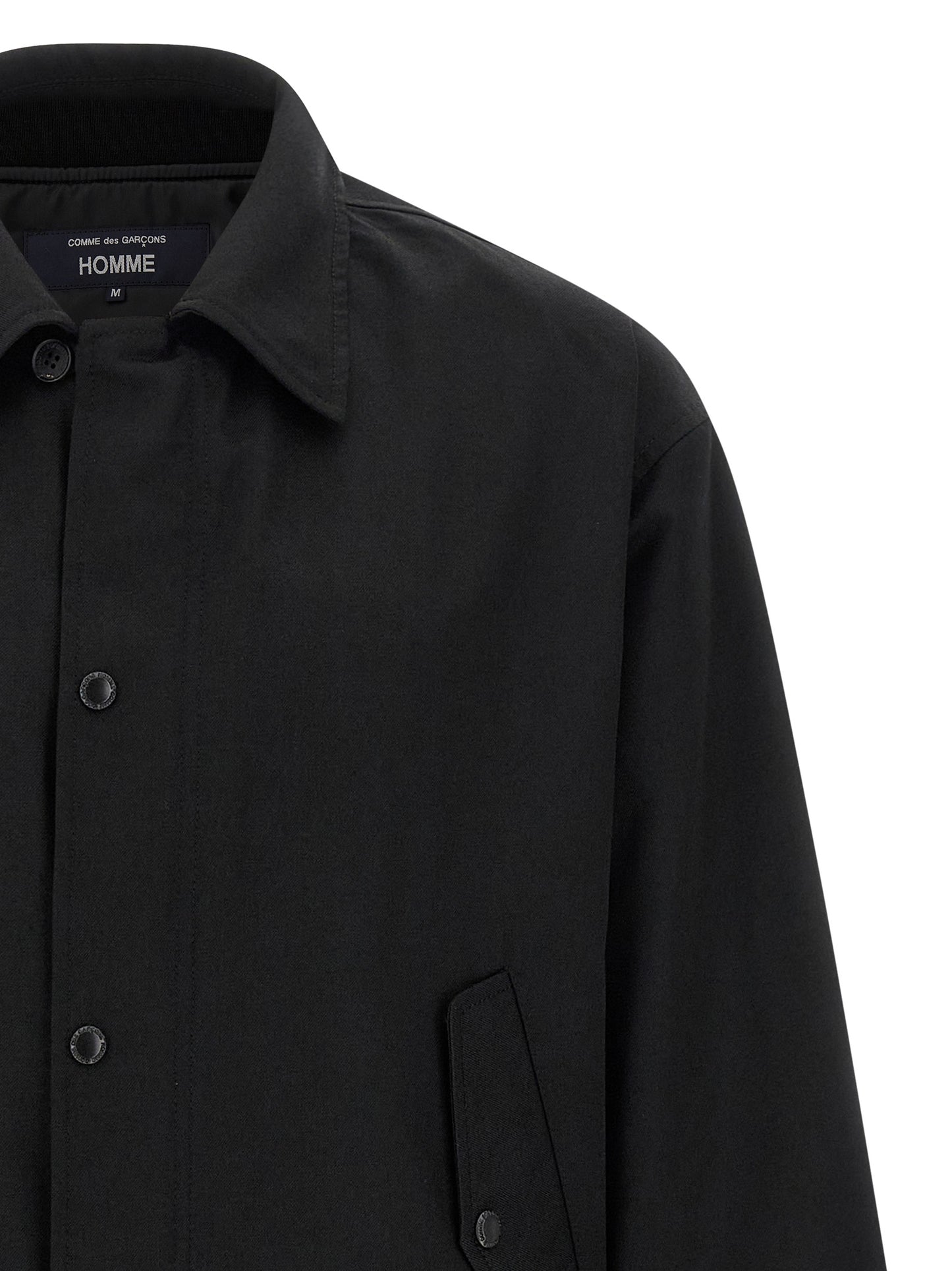 Overcoat by Comme Des Garçons for men in wool & polyester black showcases a enveloping silhouette, detailed with distinctive pockets and a enveloping .
