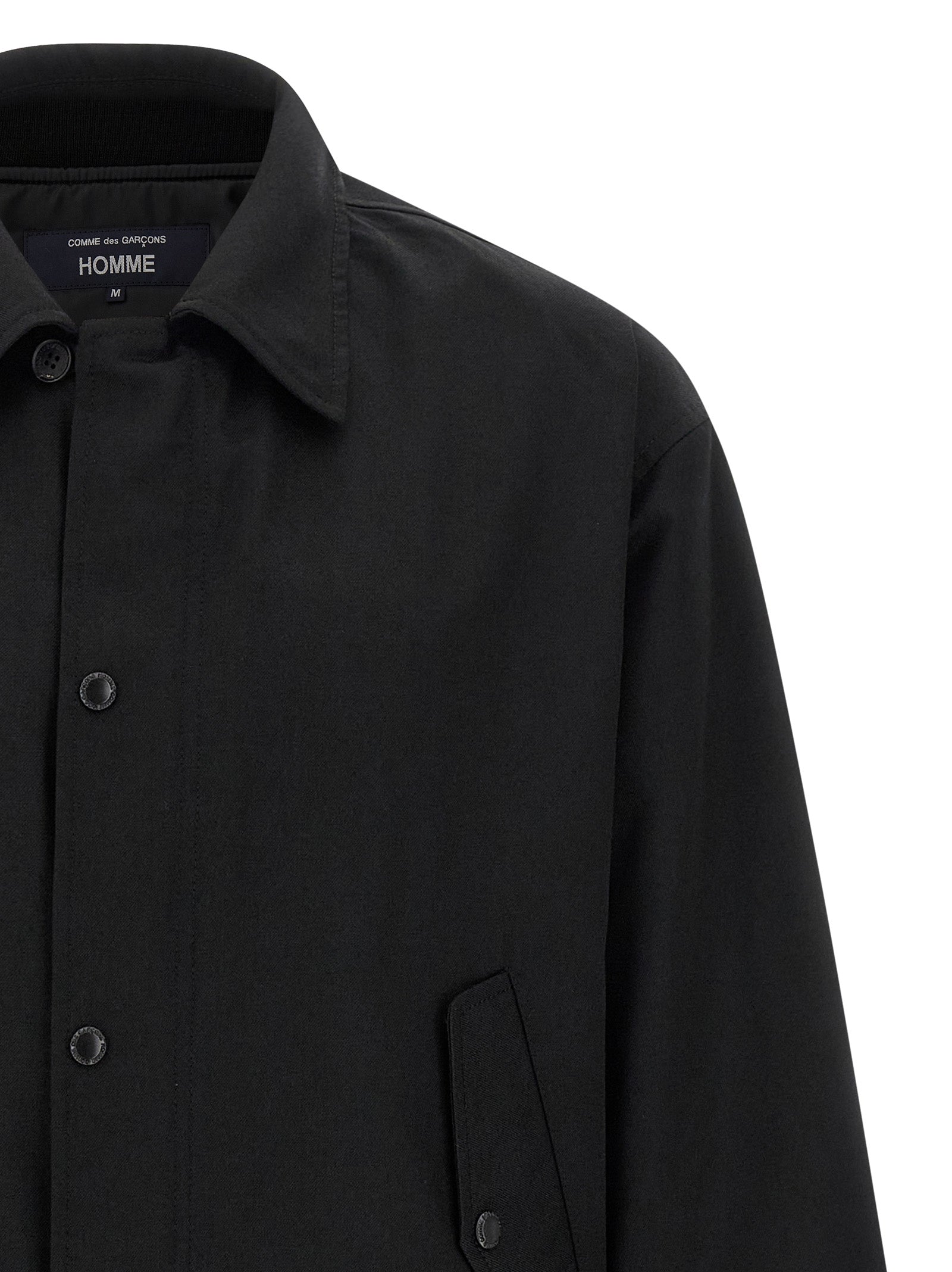 Overcoat by Comme Des Garçons for men in wool & polyester black showcases a enveloping silhouette, detailed with distinctive pockets and a enveloping .