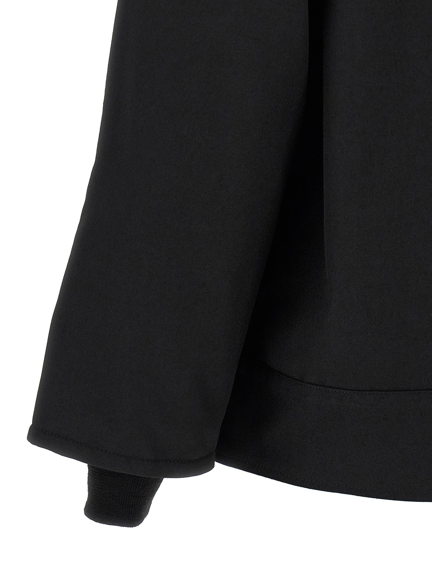 Overcoat by Comme Des Garçons for men in wool & polyester black showcases a enveloping silhouette, detailed with distinctive pockets and a enveloping .
