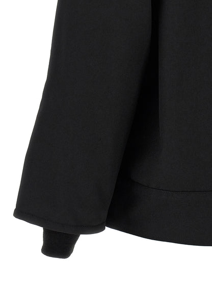 Overcoat by Comme Des Garçons for men in wool & polyester black showcases a enveloping silhouette, detailed with distinctive pockets and a enveloping .