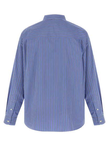 Shirt by Comme Des Garçons for men in cotton blue & striped showcases a sublime silhouette, artfully detailed with a sublime and for a sophisticated, sublime finish.