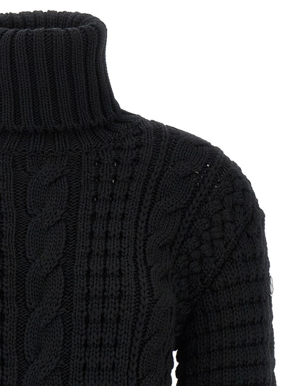 Cardigan by MONCLER GENIUS for women in virgin wool black features a dramatic silhouette, showcasing a sophisticated turtle neckline and dramatic detail for a timeless, premium look.