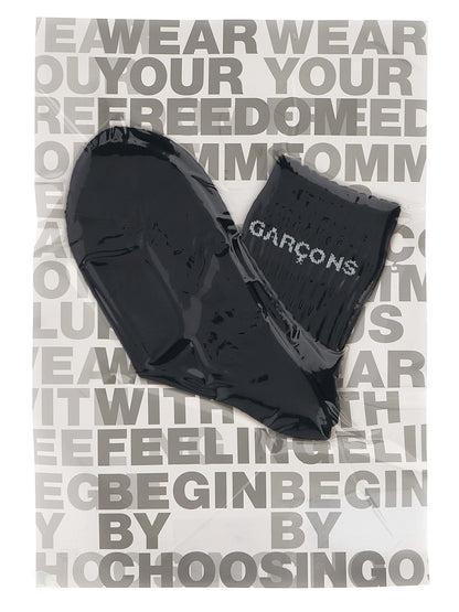 These Socks by Comme Des Garçons for men in cotton bicolour, black & white present a utilitarian silhouette from the Men's Cotton Socks collection, offering a utilitarian fit and refined aesthetic.