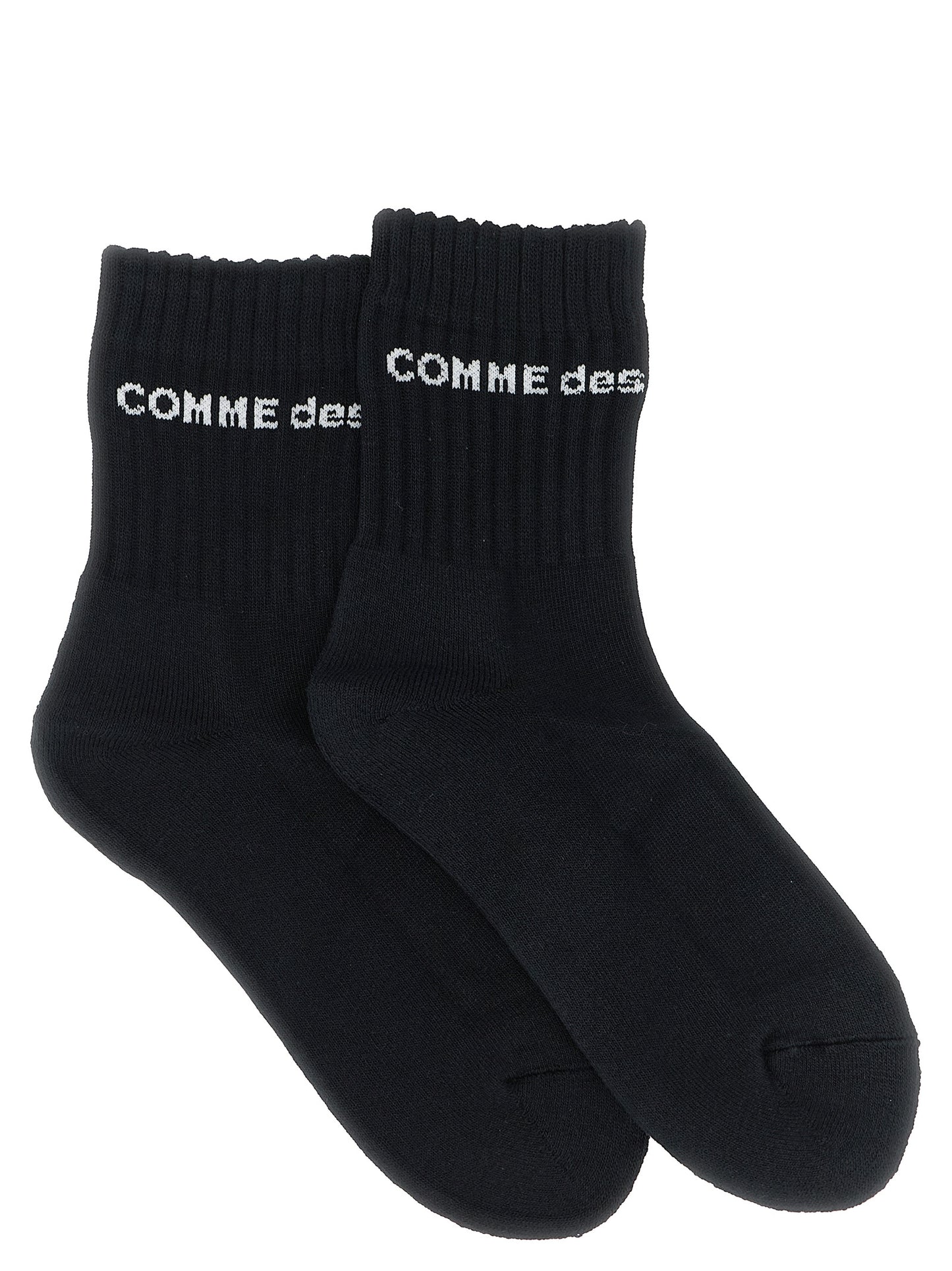 Socks by Comme Des Garçons for men in cotton bicolour, black & white features an utilitarian chic finish from the Men's Cotton Socks collection, offering an utilitarian chic fit that ensures sophisticated comfort.