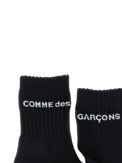 Socks by Comme Des Garçons for men in cotton bicolour, black & white features a snug silhouette, artfully capturing the essence of the snug Men's Cotton Socks design for a sophisticated look.
