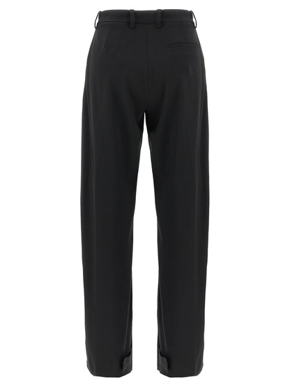 Trousers by MONCLER GENIUS for women in polyester & virgin wool black presents a perennial silhouette, meticulously tailored with a cut, long finish, and an elegant .