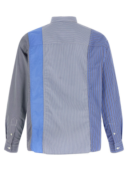 Shirt by Comme Des Garçons for men in cotton blue, patterned & patchwork showcases a sharp silhouette, elegantly detailed with a sharp and sharp .