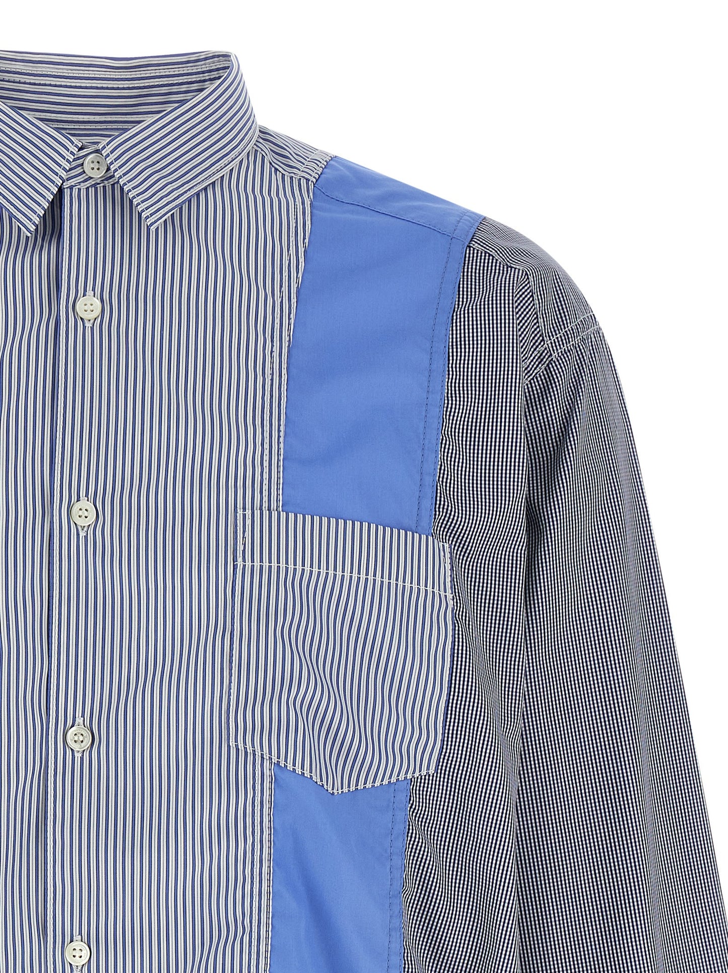 Shirt by Comme Des Garçons for men in cotton blue, patterned & patchwork showcases a sleek silhouette, elegantly detailed with a sleek and for a sleek finish.