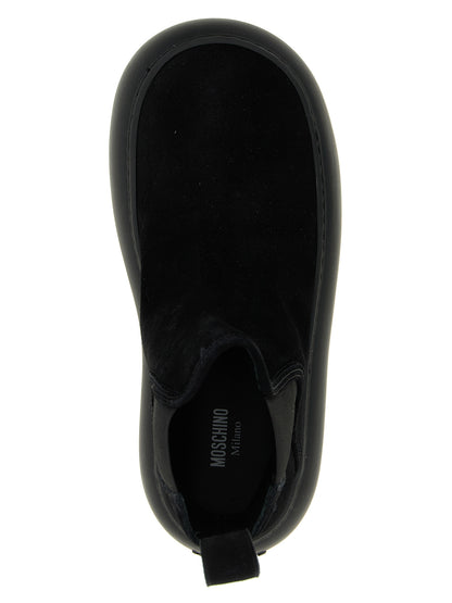 Ankle Chelsea Boots by Moschino for women in bos taurus calfskin leather black features an high-performance silhouette, showcasing the sophisticated design of the Ollie Women's Bos Taurus Calfskin Leather Ankle Chelsea Boots with a and a refined .