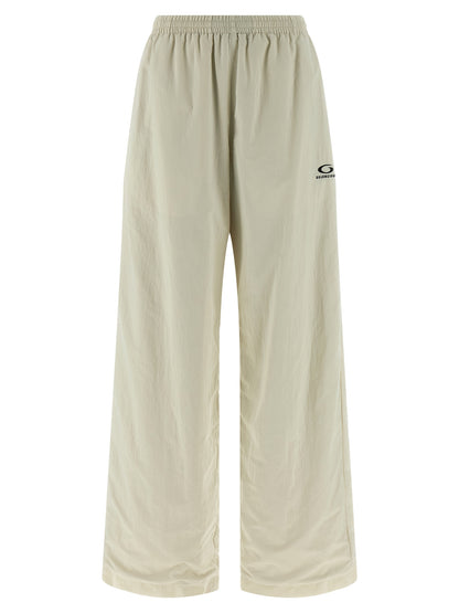 Joggers by Balenciaga for women in polyamide beige presents a refined pantology silhouette, artfully defined by a refined pantology straight-leg & wide, long, and a sophisticated .