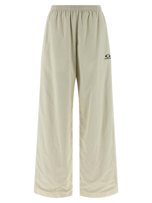 Joggers by Balenciaga for women in polyamide beige presents a refined pantology silhouette, artfully defined by a refined pantology straight-leg & wide, long, and a sophisticated .