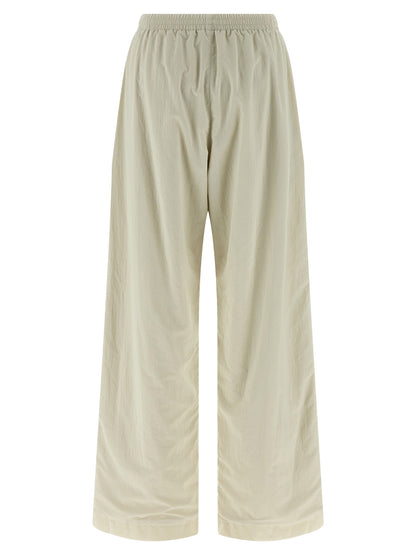 Joggers by Balenciaga for women in polyamide beige features a polished silhouette with a polished straight-leg & wide, reaching a polished long and finished with a polished .