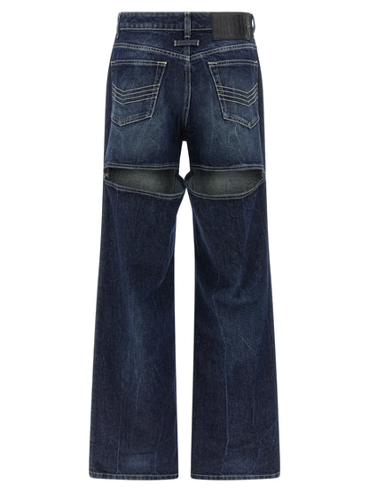 Jeans by Jean Paul Gaultier for women in cotton denim blue presents a tailored silhouette, showcasing a tailored wide and long cut with a refined for a truly tailored aesthetic.