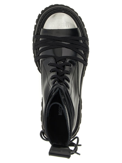 Lace-Up Combat Boots by Moschino for women in calfskin leather black features an high-performance silhouette, showcasing the sophisticated design of the Women's Calfskin Leather Lace-Up Combat Boots with a and a refined .