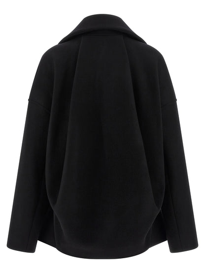 Overcoat by Rick Owens for women in virgin wool black showcases a architectural silhouette, artfully detailed with a distinctive high-neck neckline and functional pockets for a architectural finish.