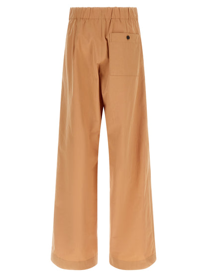 Trousers by Dries Van Noten for women in cotton multicolor & pink features a sculptural silhouette, showcasing a sculptural wide and long with a sophisticated high rise for a sculptural finish.