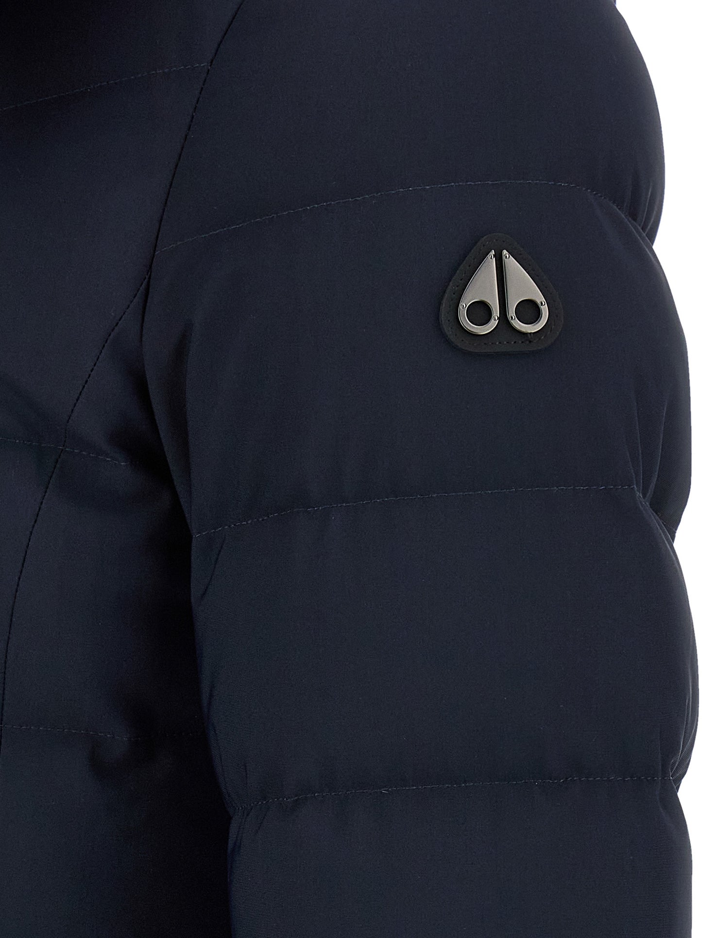 This Hooded Parka by Moose Knuckles for women in nylon leather blue presents a utilitarian silhouette, meticulously detailed with windproof & hooded and a utilitarian for a sophisticated, weather-ready look.
