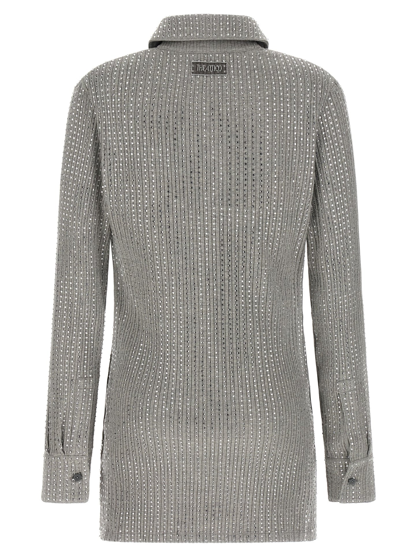 Dress by The Attico for women in cotton & rhinestone gray features an sultry silhouette defined by a v-neck neckline and , falling to an sultry short mini for a sultry look.