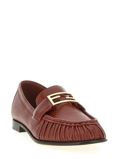 Flat Loafer Slip-On Shoes by Fendi for women in lamb leather brown features an effortless chic silhouette, showcasing the Women's Lamb Leather Flat Loafer Slip-On Shoes design with an effortless chic flat and a for a effortless chic look.