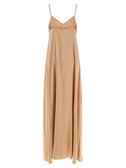 Dress by Ferragamo for women in viscose beige features an sultry silhouette defined by a v-neck neckline and , falling to an sultry long for a sultry look.