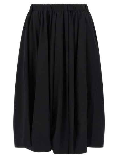 Skirt by Comme Des Garçons for women in wool black features a contoured silhouette from the Women's Wool Maxi Mini Skirt collection, characterized by its contoured maxi mini for a contoured finish.