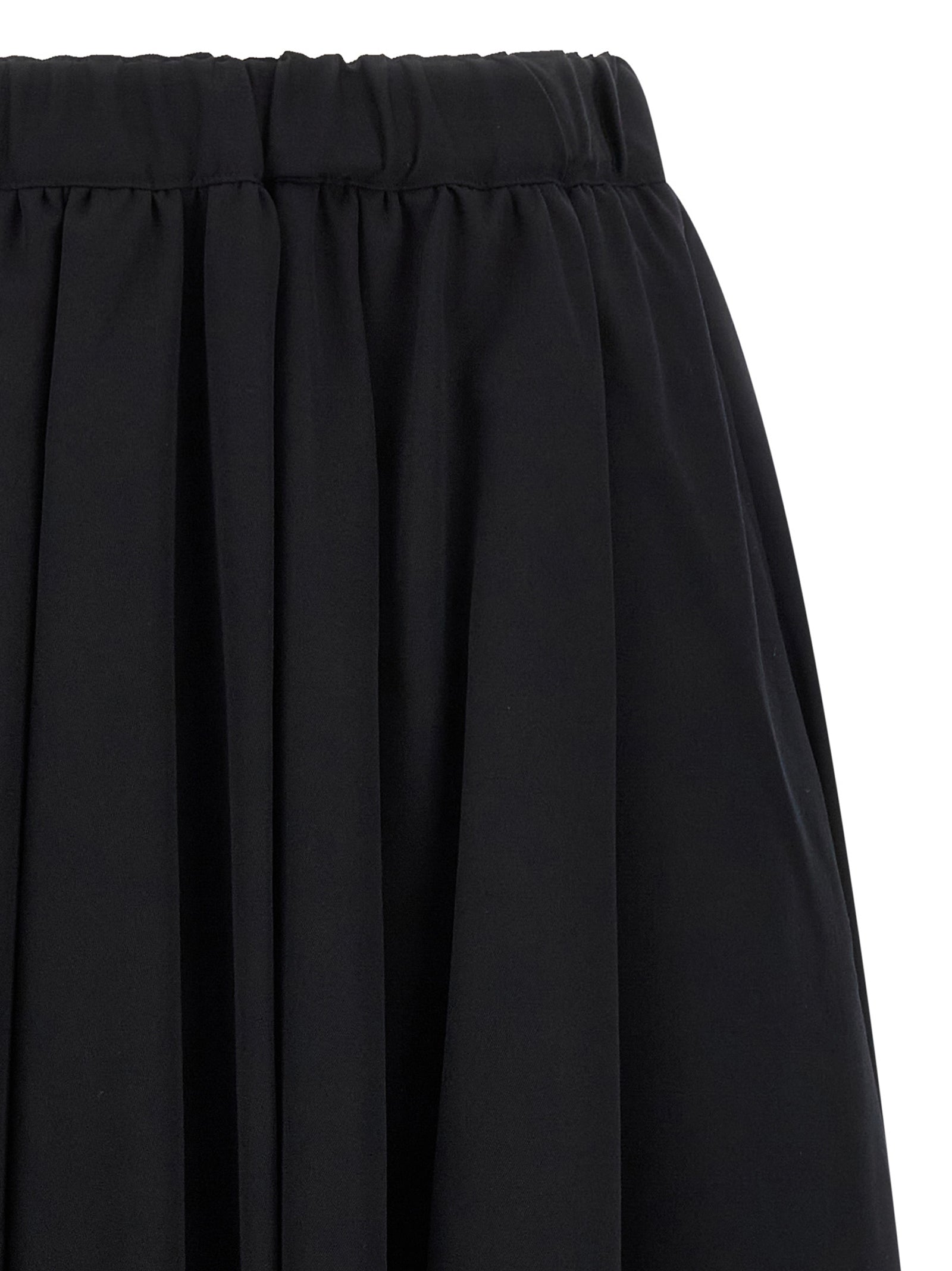 Skirt by Comme Des Garçons for women in wool black showcases a dramatic silhouette, artfully capturing the essence of the Women's Wool Maxi Mini Skirt in a dramatic maxi mini cut for a refined look.