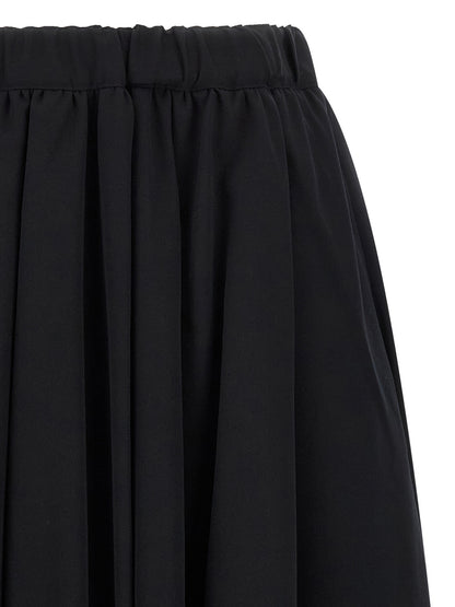 Skirt by Comme Des Garçons for women in wool black showcases a dramatic silhouette, artfully capturing the essence of the Women's Wool Maxi Mini Skirt in a dramatic maxi mini cut for a refined look.