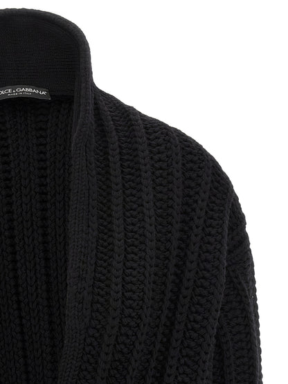 Cardigan by Dolce & Gabbana for women in virgin wool black showcases a luxurious silhouette, meticulously detailed with a sophisticated shawl-collar neckline and for a refined finish.