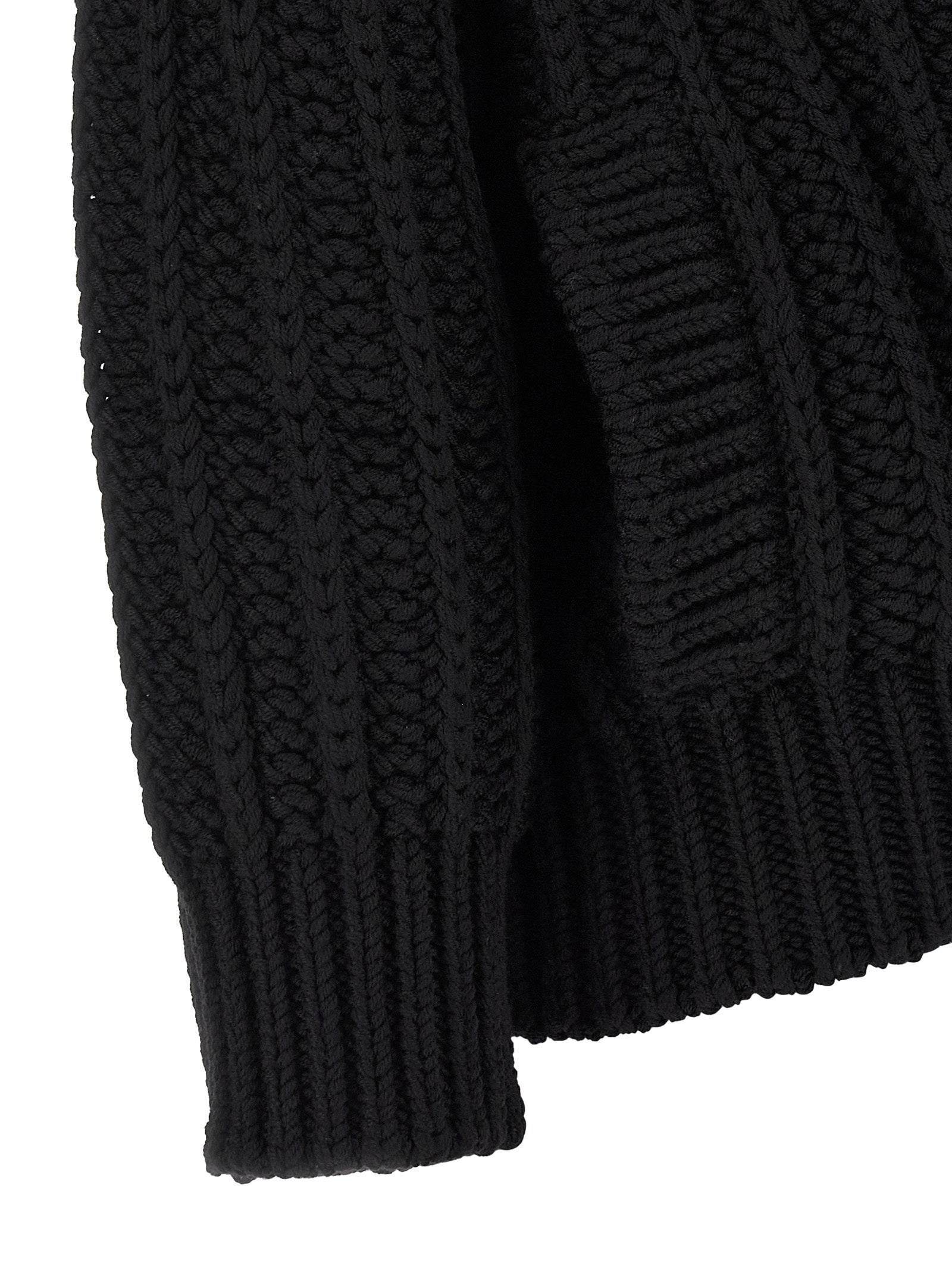 Cardigan by Dolce & Gabbana for women in virgin wool black showcases a captivating silhouette, artfully detailed with a captivating and for a truly sophisticated captivating look.