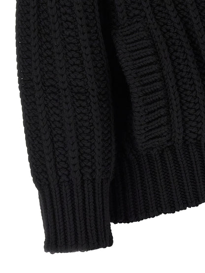 Cardigan by Dolce & Gabbana for women in virgin wool black showcases a captivating silhouette, artfully detailed with a captivating and for a truly sophisticated captivating look.
