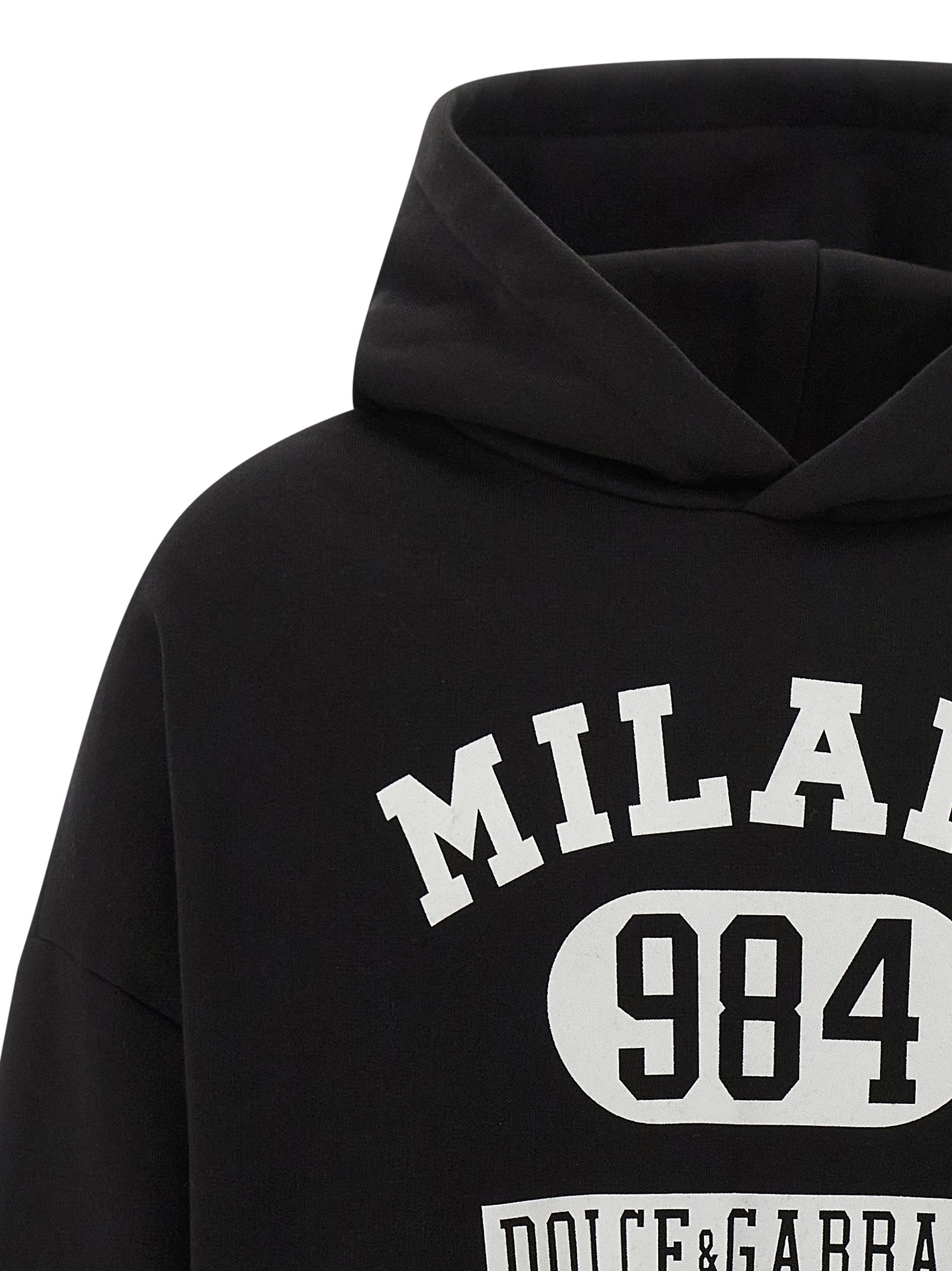 Sweatshirt Hoodie by Dolce & Gabbana for men in cotton bicolour, black, white & print features an dramatic silhouette, showcasing a sophisticated hooded neckline and dramatic for a refined, modern aesthetic.