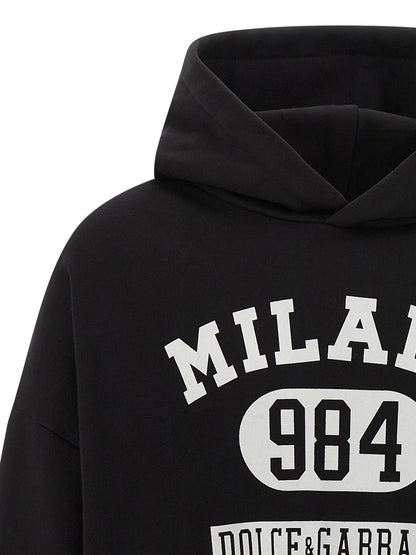 Sweatshirt Hoodie by Dolce & Gabbana for men in cotton bicolour, black, white & print features an dramatic silhouette, showcasing a sophisticated hooded neckline and dramatic for a refined, modern aesthetic.