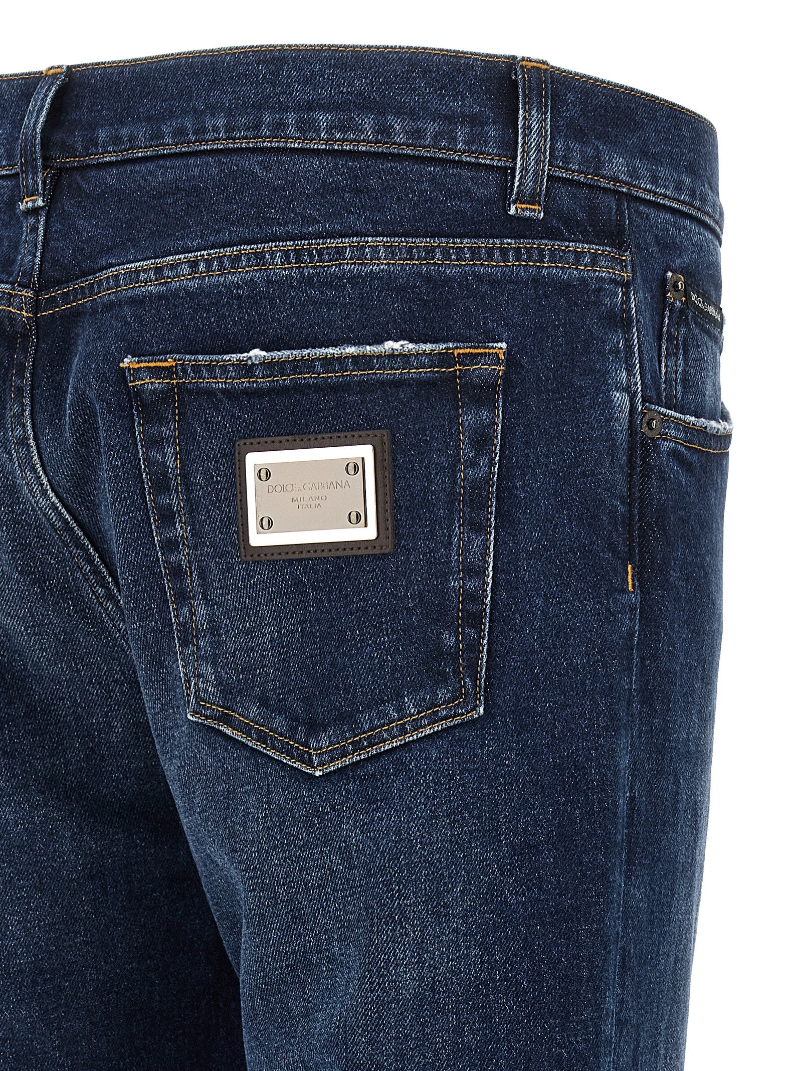 Jeans by Dolce & Gabbana for men in denim cotton blue features a polished silhouette with a polished straight-leg, reaching a polished long and finished with a polished low rise.