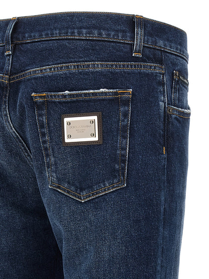 Jeans by Dolce & Gabbana for men in denim cotton blue features a polished silhouette with a polished straight-leg, reaching a polished long and finished with a polished low rise.