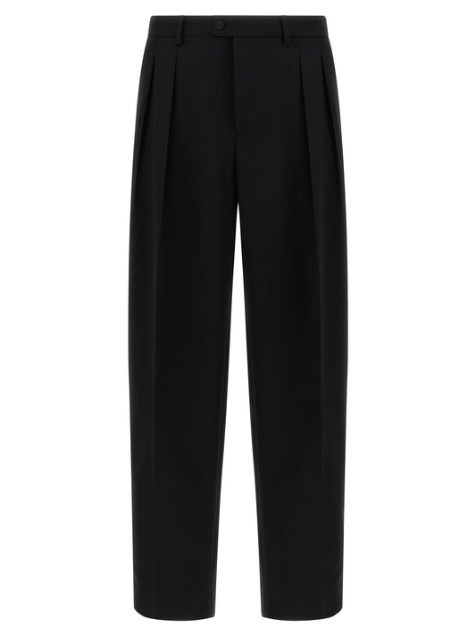 Trousers by Dolce & Gabbana for men in virgin wool black features a tailored silhouette with a tailored straight-leg & wide, defined by its long and a sophisticated .