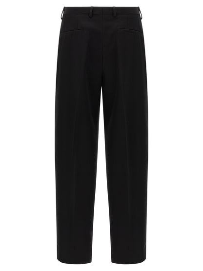Trousers by Dolce & Gabbana for men in virgin wool black features a sculptural silhouette, showcasing a sculptural straight-leg & wide and long with a sophisticated for a sculptural finish.