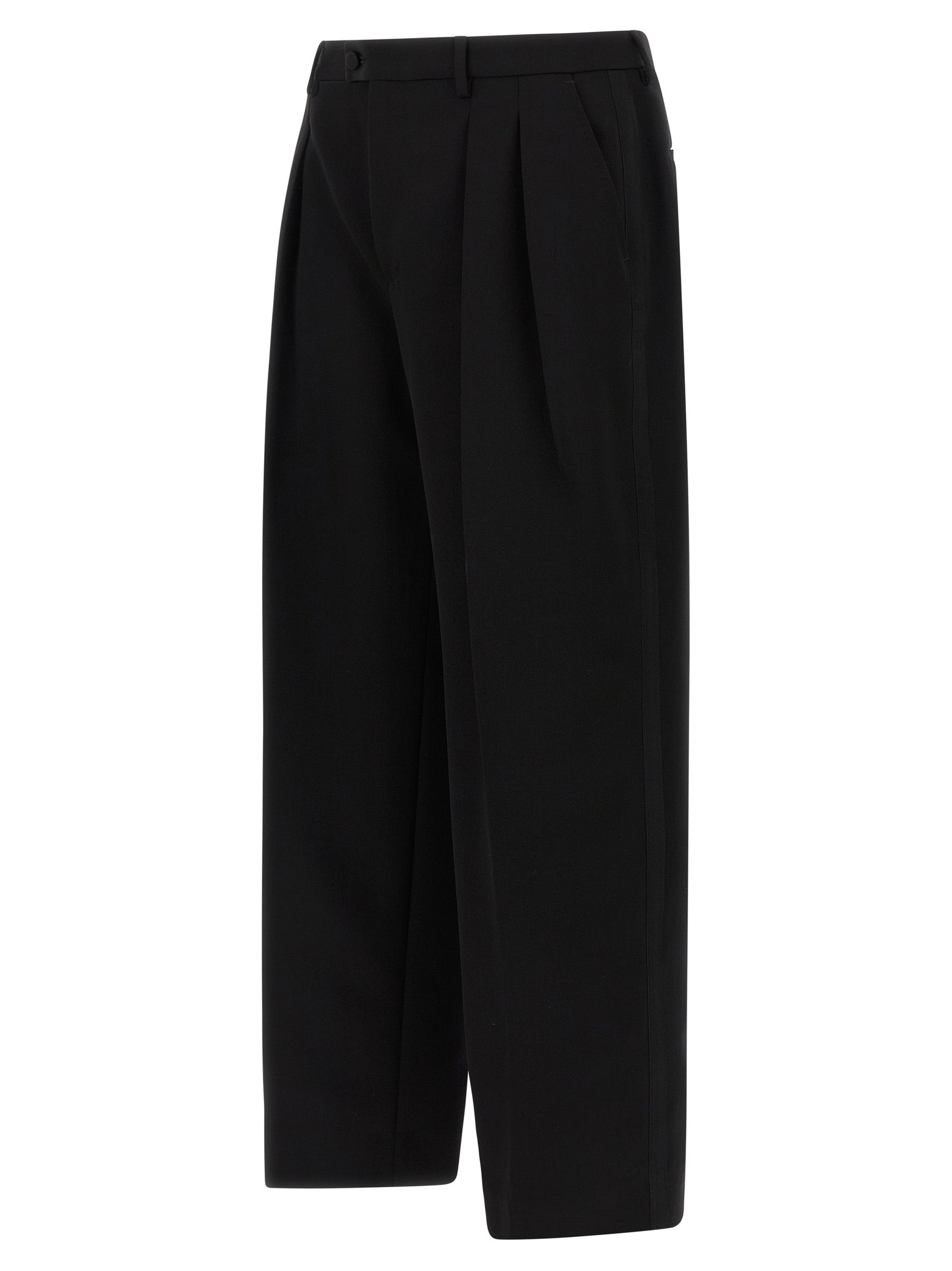 Trousers by Dolce & Gabbana for men in virgin wool black presents a perennial silhouette, meticulously tailored with a straight-leg & wide cut, long finish, and an elegant .