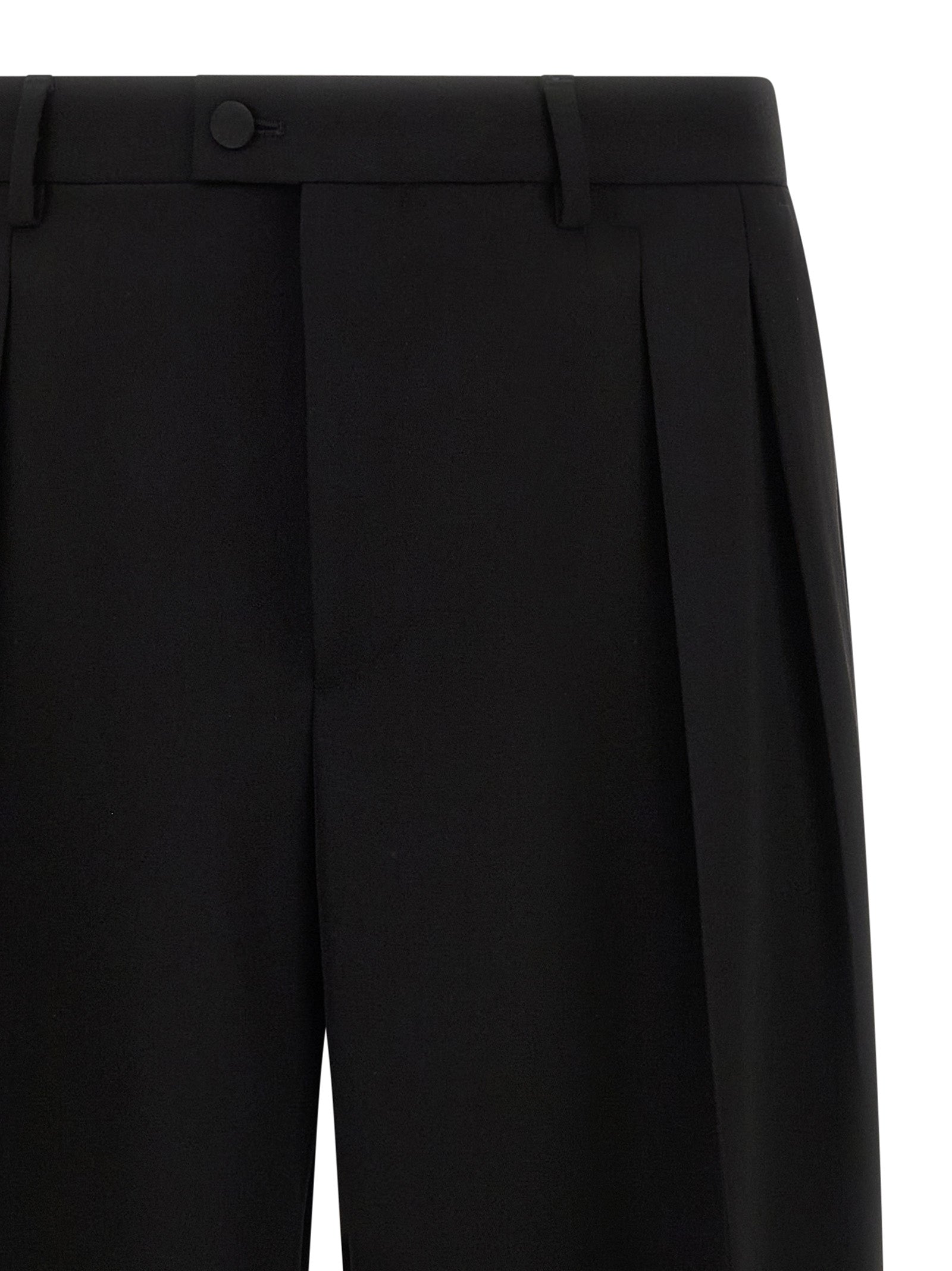 Trousers by Dolce & Gabbana for men in virgin wool black presents a smart silhouette, meticulously detailed with a smart straight-leg & wide, a smart long, and a smart .