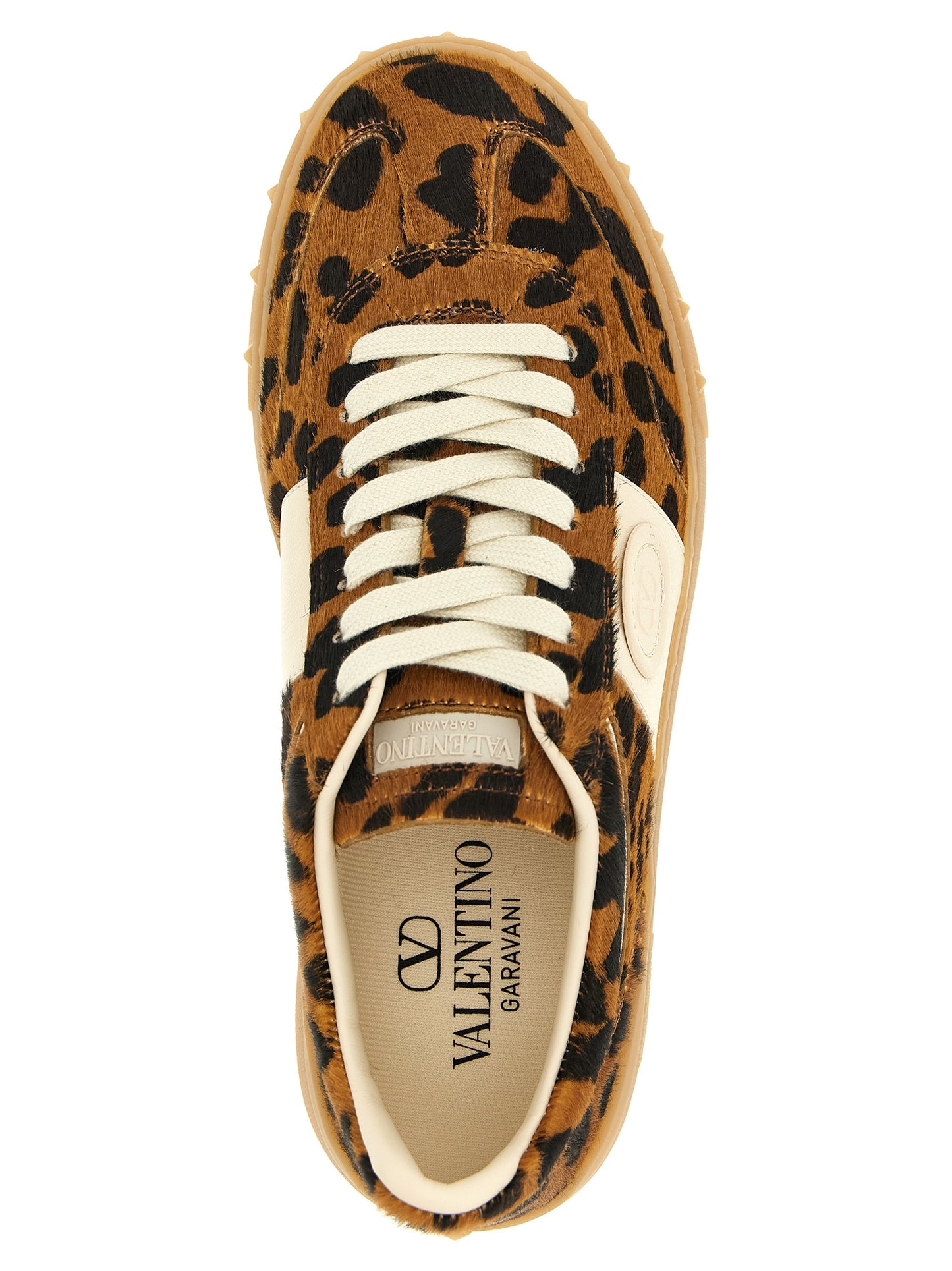 Sneakers by Valentino Garavani for women in calfskin leather animal, brown, signature & print presents a on trend silhouette from the Pony V Logo Women's Low Top Calfskin Leather Sneakers collection, showcasing a on trend low-top style for an elevated aesthetic.