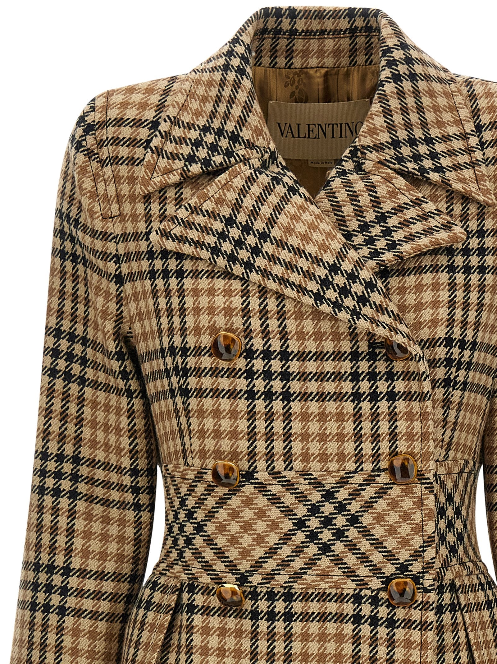 Overcoat by Valentino Garavani for women in virgin wool & cupro brown & monogram features an voluminous silhouette, showcasing distinct pockets & insulated and a voluminous split lapel neckline for a truly voluminous aesthetic.