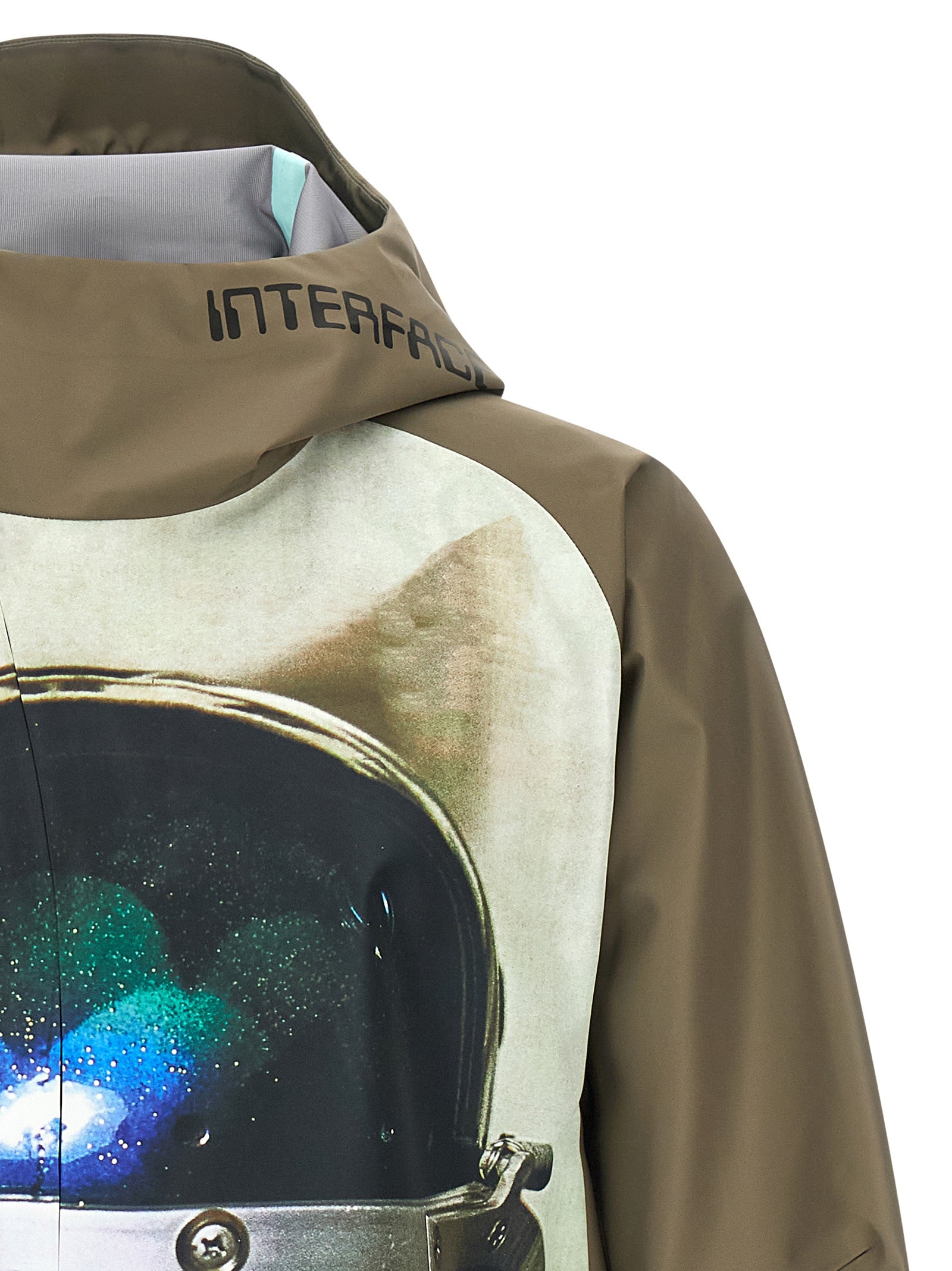 Hooded Windbreaker Jacket by Undercover for men in nylon bicolour, green & print presents a resilient silhouette, artfully detailed with a sophisticated hooded high-neck neckline and functional pockets, hooded & windproof for a resilient finish.