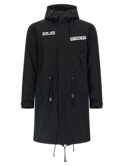 This Hooded Parka by Undercover for men in nylon cotton black presents a enveloping silhouette, meticulously detailed with pockets & hooded and a enveloping hooded high-neck neckline.