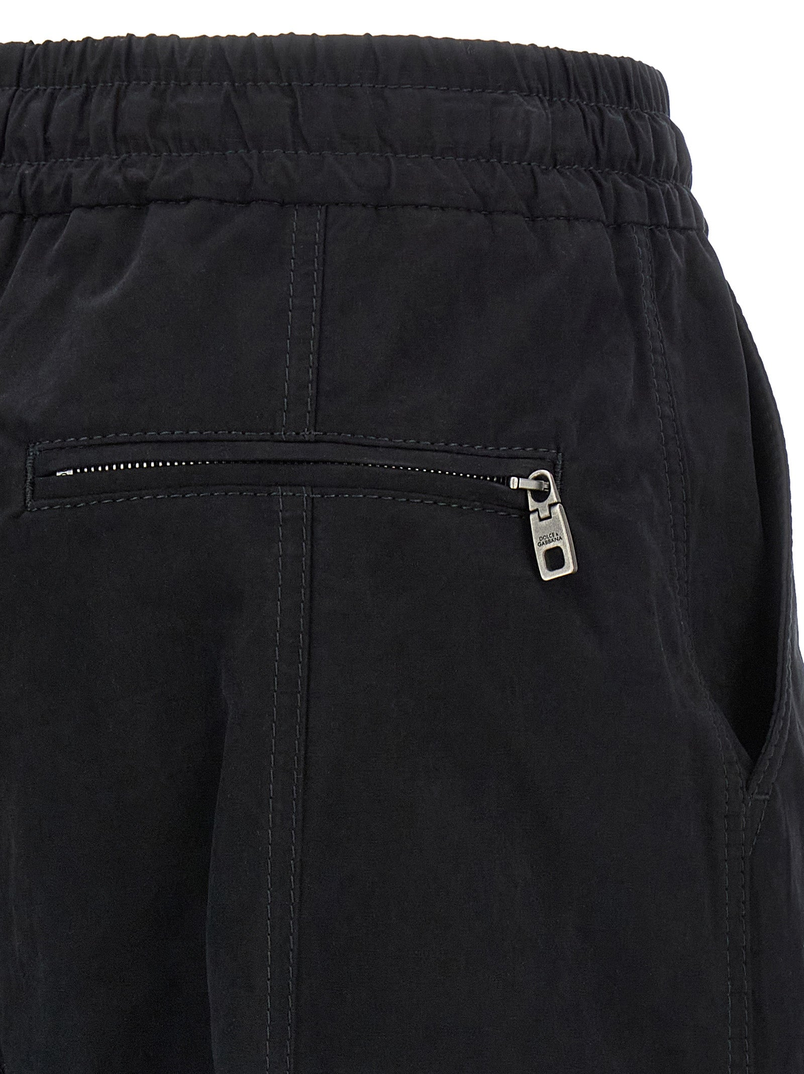 Cargo Pants by Dolce & Gabbana for women in polyamide polyester & cotton black features an tailored wide with a low rise and long, creating a tailored utilitarian silhouette.